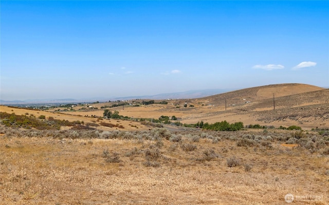 property view of mountains featuring a rural view