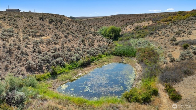 property view of mountains featuring a water view