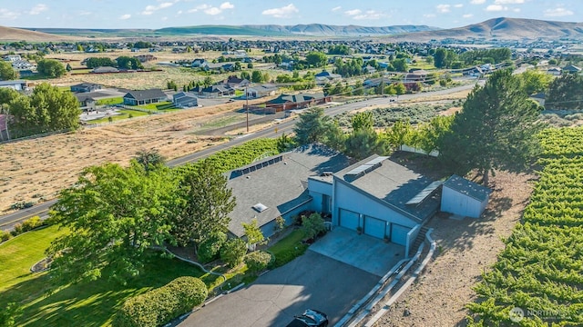 birds eye view of property featuring a mountain view