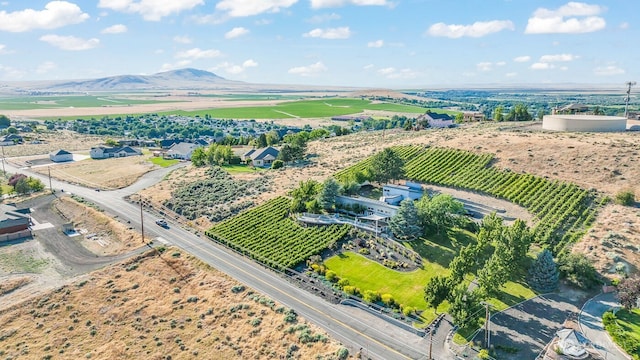 birds eye view of property with a rural view