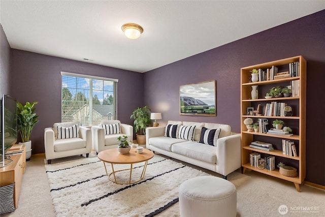 living room featuring visible vents and carpet