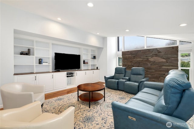 living area with recessed lighting and wood finished floors