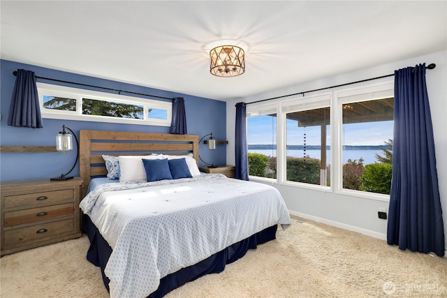 carpeted bedroom with baseboards