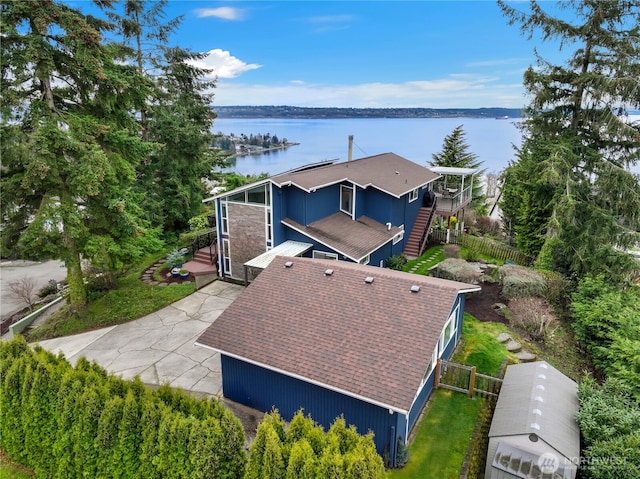 birds eye view of property with a water view