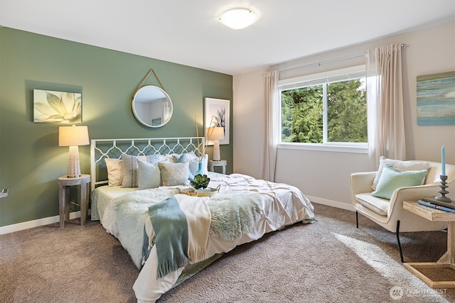 carpeted bedroom with baseboards