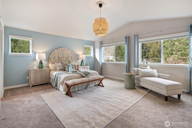 carpeted bedroom with visible vents, baseboards, and vaulted ceiling