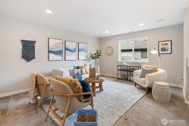 living area with visible vents, recessed lighting, baseboards, and light carpet