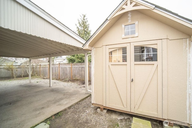 view of shed with fence