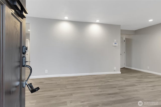 foyer featuring recessed lighting, light wood-type flooring, and baseboards