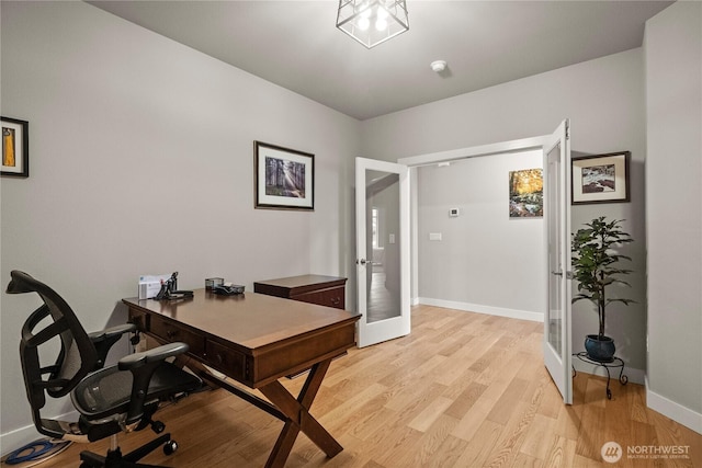 office with french doors, light wood-type flooring, and baseboards