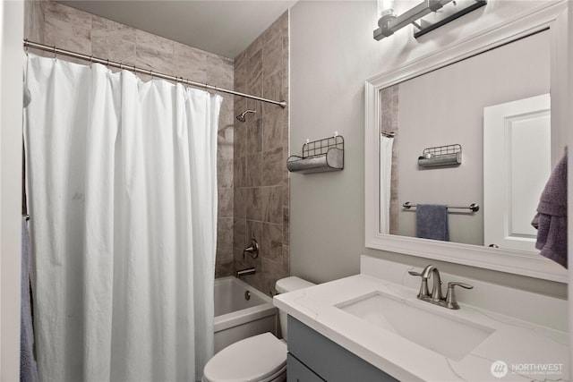 full bath featuring shower / bath combo with shower curtain, toilet, and vanity