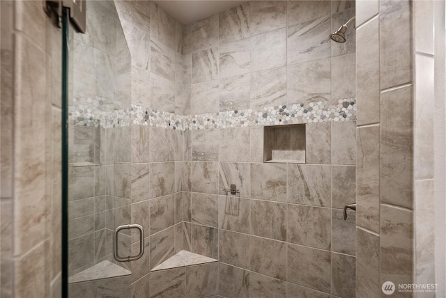 full bath featuring a shower stall