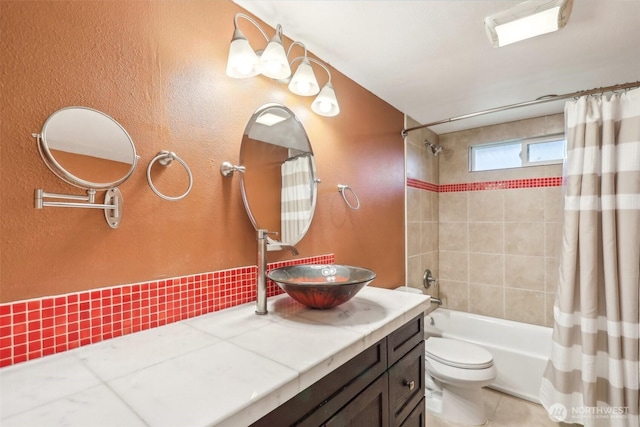 full bathroom with tile patterned floors, vanity, toilet, and shower / tub combo