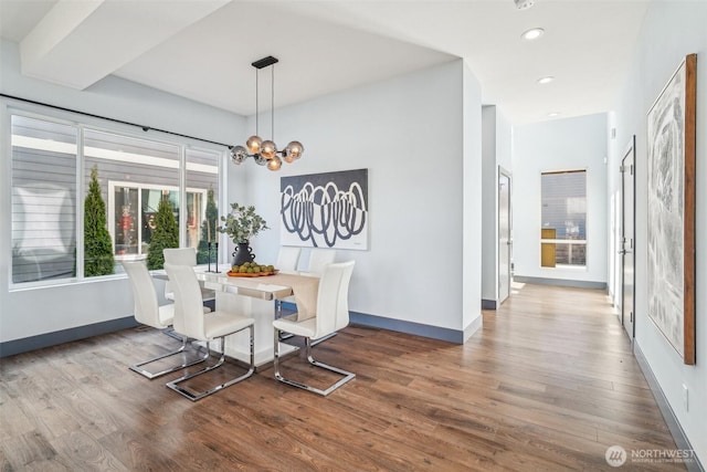 dining room featuring recessed lighting, an inviting chandelier, baseboards, and wood finished floors