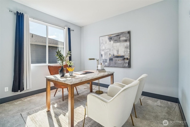 carpeted home office with baseboards