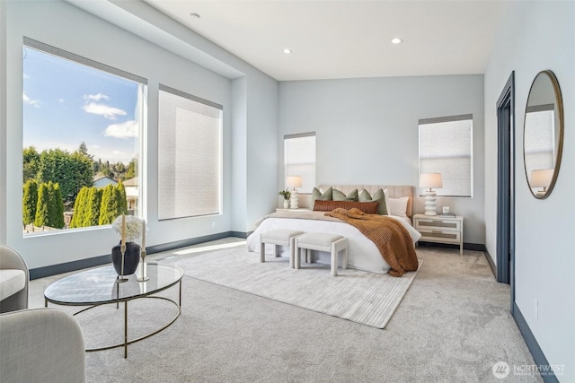 carpeted bedroom featuring recessed lighting and baseboards