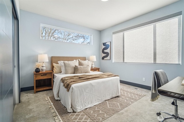 bedroom with visible vents, carpet, and baseboards