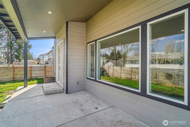 view of patio featuring fence