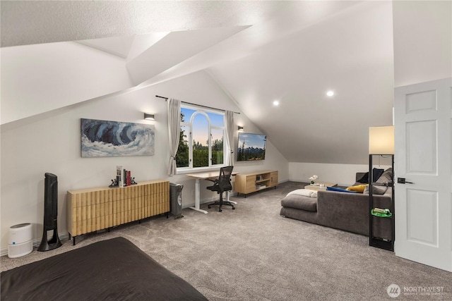 carpeted office space featuring baseboards and vaulted ceiling