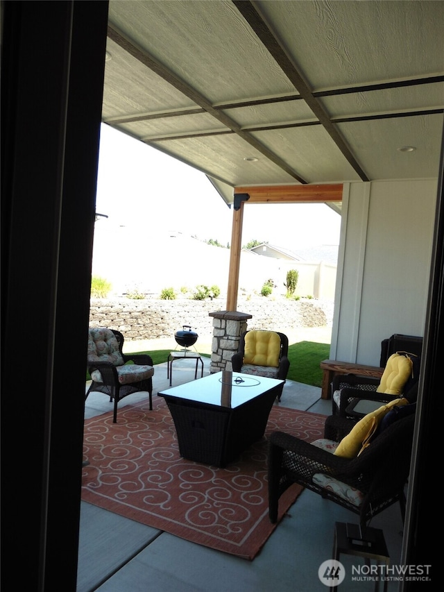 view of patio featuring fence