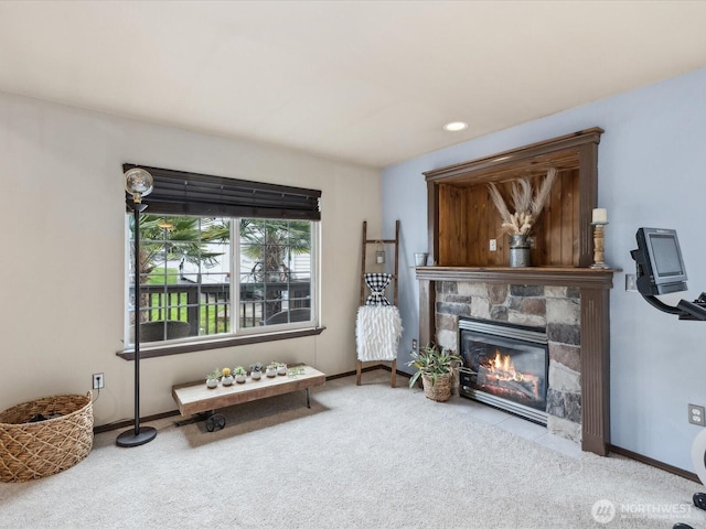 living area with recessed lighting, baseboards, carpet floors, and a fireplace