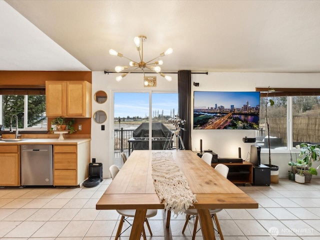 dining area featuring a notable chandelier and light tile patterned floors