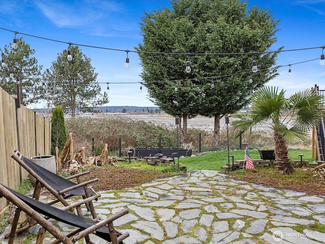 view of patio / terrace featuring fence