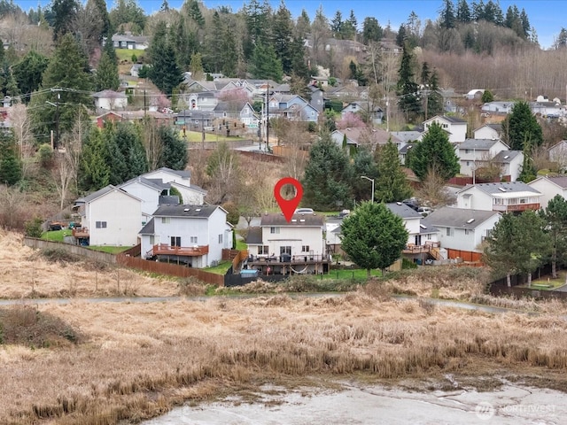 birds eye view of property with a residential view