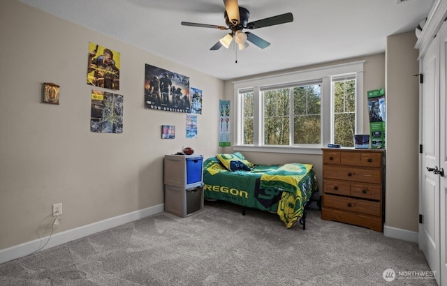 bedroom featuring baseboards, carpet, and ceiling fan