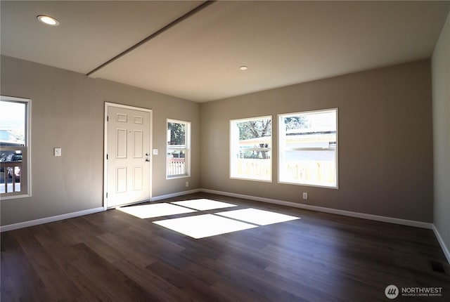 foyer entrance featuring dark wood finished floors, visible vents, recessed lighting, and baseboards