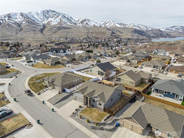 birds eye view of property with a mountain view and a residential view