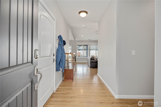 entrance foyer with recessed lighting, light wood-type flooring, and baseboards