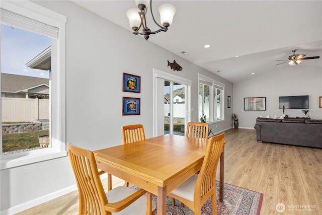 dining area featuring visible vents, baseboards, light wood-type flooring, lofted ceiling, and recessed lighting