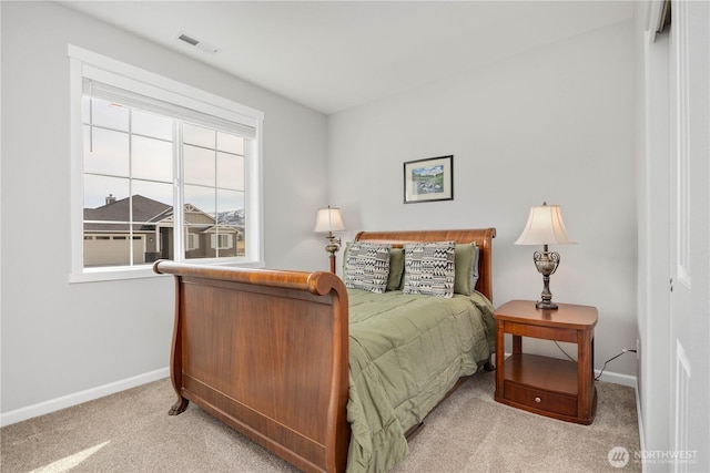 bedroom with visible vents, baseboards, and carpet flooring