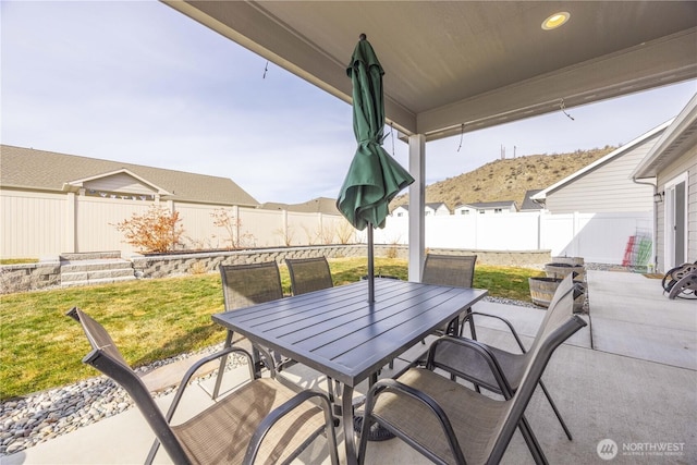 view of patio / terrace with outdoor dining area and a fenced backyard