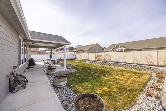 view of yard with a patio and a fenced backyard