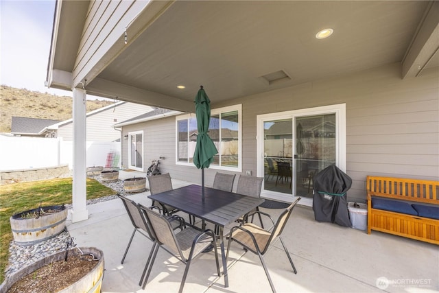 view of patio / terrace featuring outdoor dining area and fence