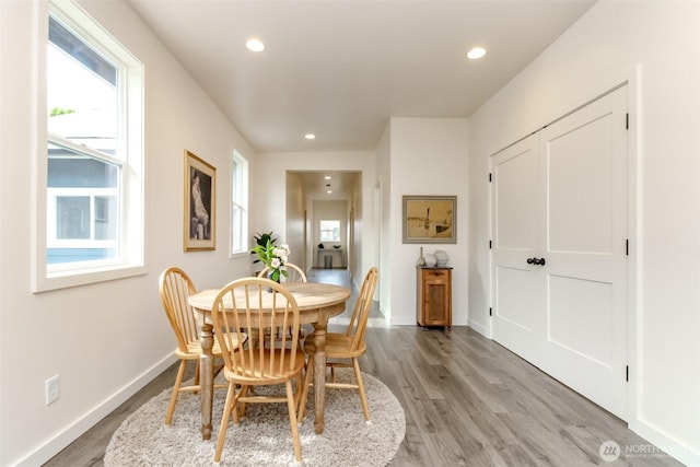 dining area with recessed lighting, a healthy amount of sunlight, baseboards, and light wood-style floors