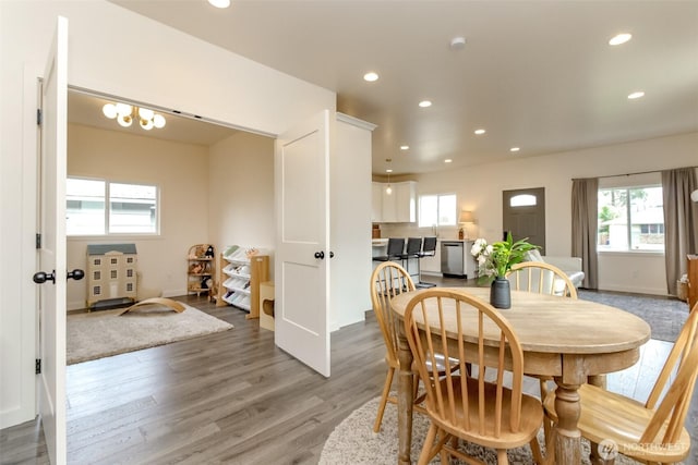 dining room featuring recessed lighting, baseboards, and wood finished floors