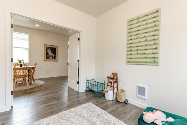 interior space featuring recessed lighting, baseboards, and wood finished floors