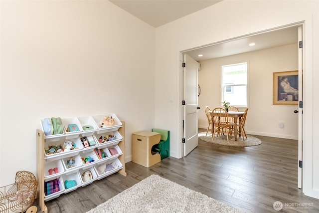 rec room featuring recessed lighting, baseboards, and wood finished floors