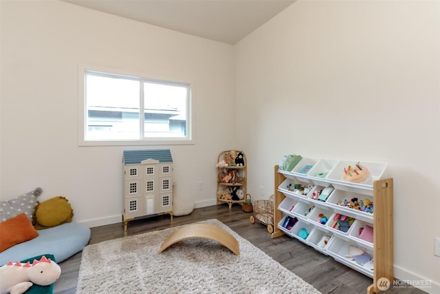 rec room featuring baseboards and wood finished floors