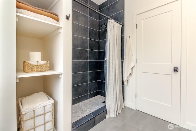 bathroom with tiled shower