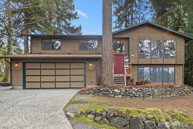 view of front of home with a garage and driveway