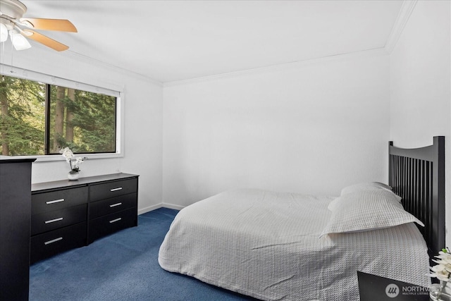 bedroom with a ceiling fan, baseboards, dark carpet, and ornamental molding