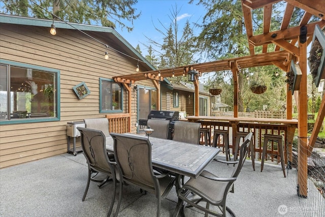 view of patio featuring outdoor dining area and a grill