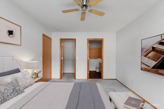 bedroom with a spacious closet, carpet flooring, baseboards, and a closet