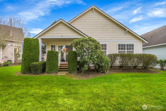 view of front of property with covered porch and a front yard