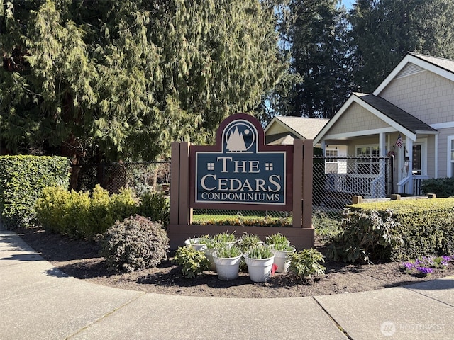 community sign with fence