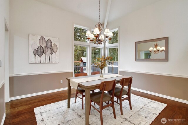 dining space featuring a notable chandelier, high vaulted ceiling, baseboards, and wood finished floors